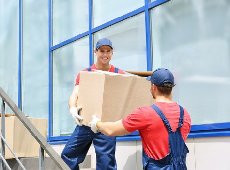 Students storing boxes and belongings in a Wimbledon local storage setting