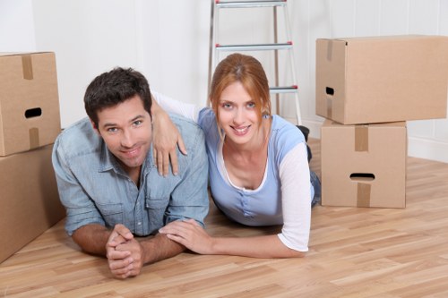 Moving van and packed boxes in a Wimbledon residential street