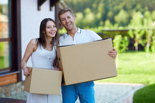 Removal team handling furniture for a home move in Wimbledon
