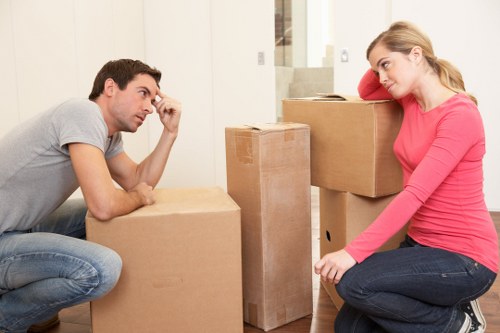 Local moving team loading boxes for a flat move in Wimbledon
